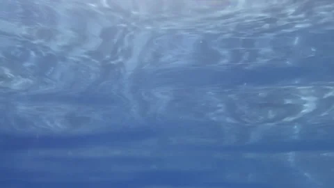 Water surface view from underwater handheld camera movement Stock Footage 276163591
