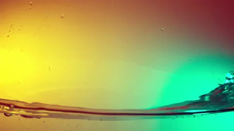 Water surface wave on colorful background shooting with a high speed camera. Stock Footage 95530457