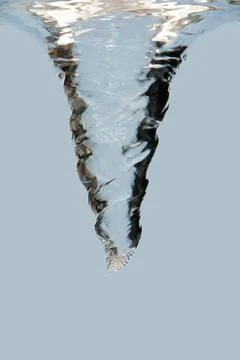 Water swirl vortex Side view of an underwater vortex swirl with bubbles, i... Stock Photos