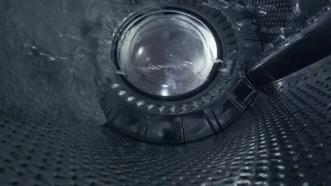 Water Swirling Inside Empty Washing Machine Drum During Rinse Cycle Stock Footage 332908813
