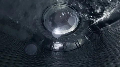 Water Swirling Inside Empty Washing Machine Drum During Rinse Cycle Stock Footage 332908828