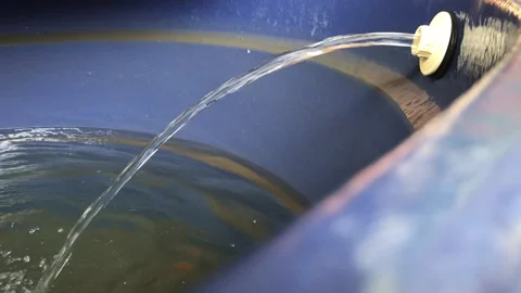 Water tank being filled with clear drinking water, showcasing water supply .. Stock Footage 275598103