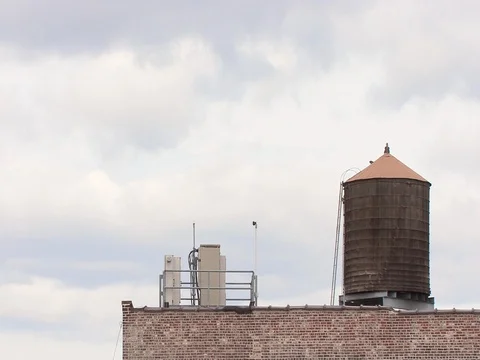 Water tank on top of building Stock Footage 128935169