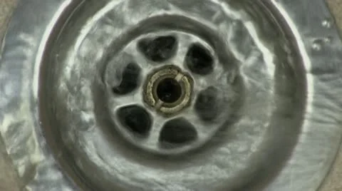 Water from a tap going down the kitchen sink Stock Footage 21224412