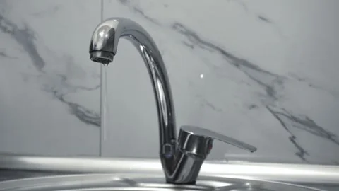 Water tap in a kitchen Stock Footage 311880040