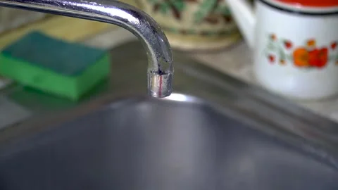 The water tap in the kitchen is leaking Stock Footage 145680893