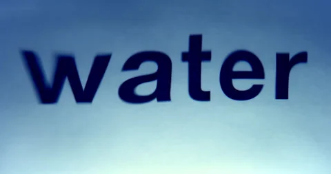 WATER Text Distorted Through Wavy Water Surface Stock Footage 341597295