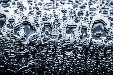 Water texture abstract background, aqua drops on silver glass as science macr Stock Photos