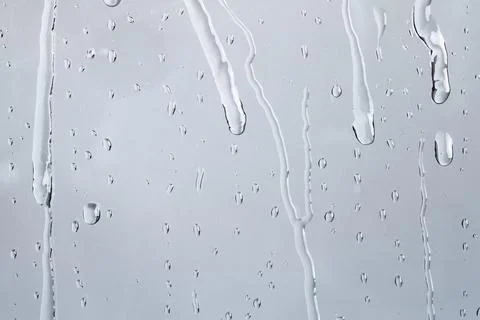 Water texture background, rainy window on cloudy day Stock Photos