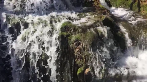 Water texture in the river coast shore. Crystal clear water Stock Footage 80564448