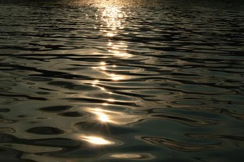 Water texture sunset Stock Photos