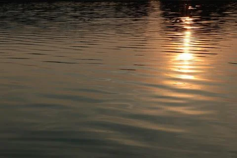 Water texture sunset Stock Photos