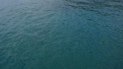 Water texture of turquoise sea surface with vibrant pattern, copy space Stock Footage 137654250
