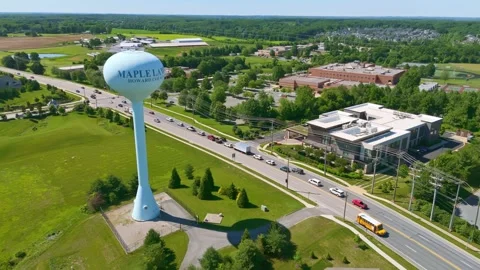 Water tower and surrounding suburb in Maple Lawn, Maryland drone Orbit Stock Footage 336698478