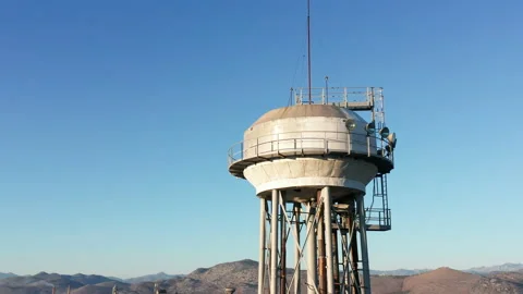 Water tower - elevated liquid storage tank. Metal reservoir for compressed gases Stock Footage 144172659