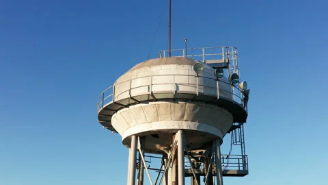 Water tower - elevated liquid storage tank. Metal reservoir for chemicals Stock Footage 144177209