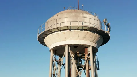 Water tower - elevated liquid storage tank. Metal reservoir for compressed gases Stock Footage 144180521