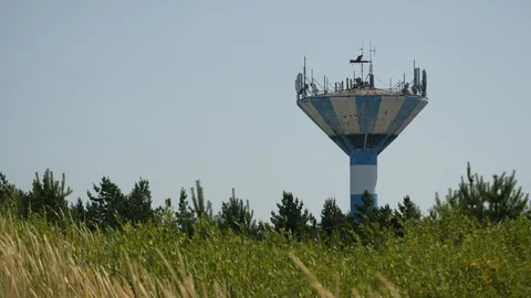 Water Tower elevated structure supporting water tank. Constructed to pressurize. Stock-Footage 129381960