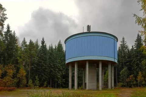 Water tower in a forest Stock Photos