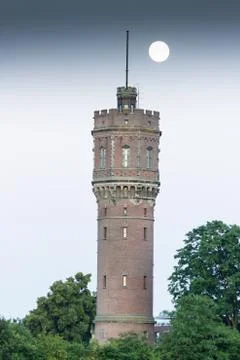 Water tower with full moon Foto stock
