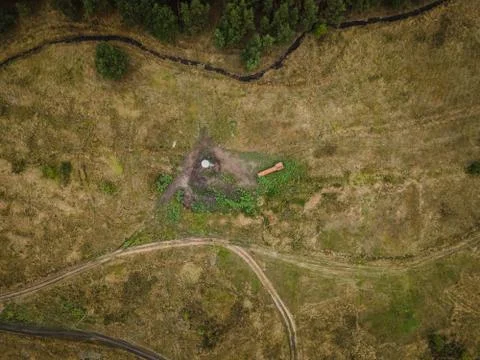 Water tower next to a pine forest view from the sky Stock Photos