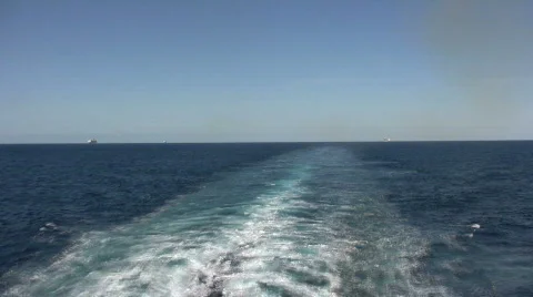 Water trail behind ship Stock Footage 300080