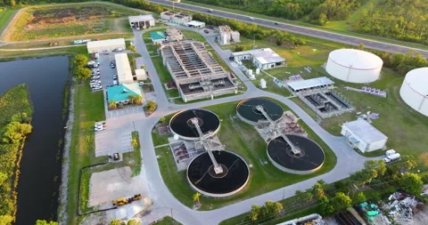 Water treatment facility with multiple tanks and filtration units. Vital Stock Footage 310705436