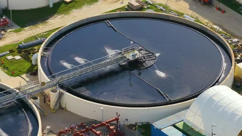 Water treatment facility with multiple tanks and filtration units. Vital Stock Footage 312242682