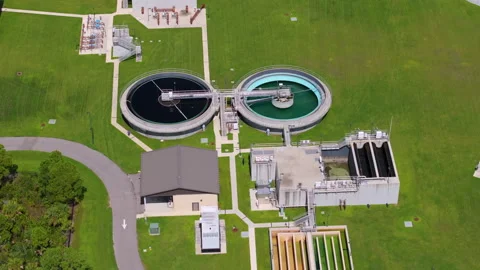 Water treatment facility with multiple tanks and filtration units. Vital Stock Footage 318112717