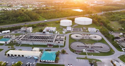Water treatment facility with multiple tanks and filtration units. Vital Stock Footage 318112860