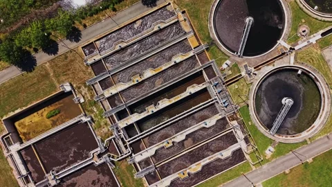 Water treatment facility in operation with multiple processing tanks Stock Footage 338406246