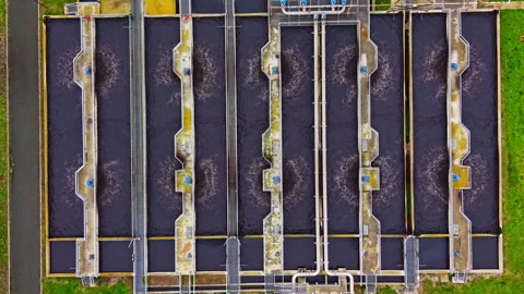 Water treatment facility processes large amounts of wastewater in an industrial Stock Footage 335423929