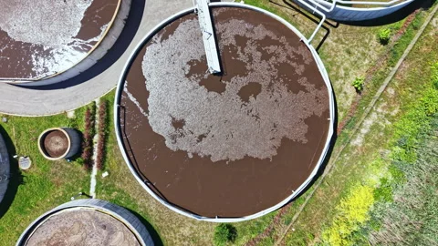 Water treatment facility processes wastewater at a municipal site on a sunny day Video stock 337900982