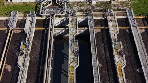 Water treatment facility processes wastewater during daytime Stock Footage 337940084