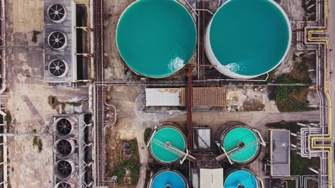 Water treatment facility shows large tanks filled with blue liquid Stock Footage 340383379