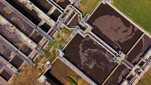 Water treatment facility shows process in action near urban area Video stock 338406052