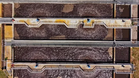 Water treatment process in facility with tanks and paths Video stock 338405910