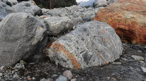 Water trickles down rocky stream 動画素材 52214959
