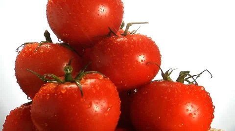 Water trickles off stack of red tomatoes rotating in frame Stock Footage 46586280