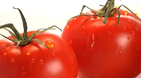 Water trickles off two red tomatoes Stock Footage 46586257