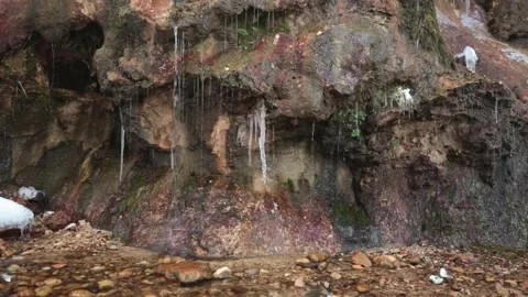 Water trickling and splashing down a rocky stream bank into the stream Stock Footage 152001784