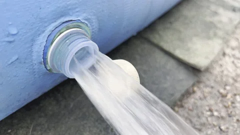 Water under high pressure flows through valve of inflatable pool. Natural cam Stock Footage 203994826