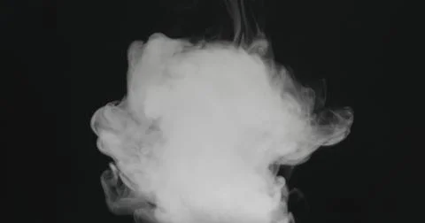 Water vapor cloud comes from below over black background with motion blur Stock Photos