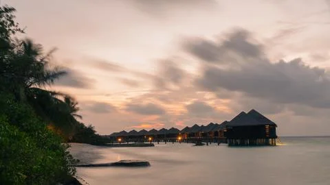 Water villas with a dramatic sky in the background Stock Photos