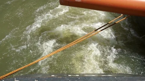 Water wake of the engine of a small boat which stops slowly Stock Footage 71178980