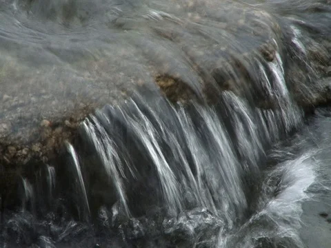 Water washes stone Stock Footage 91785873