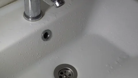 Water Waste on Tooth Brushing Stock Footage 129633895