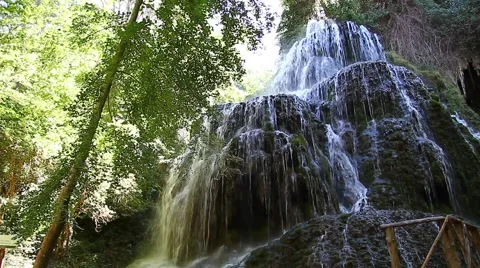 The water from the waterfall flowing between rocks Stock Footage 40117160