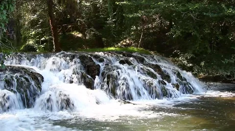 The water from the waterfall flowing between rocks Stock Footage 40119772