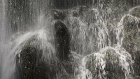 Water from a waterfall hitting rocks. Stock Footage 200925818